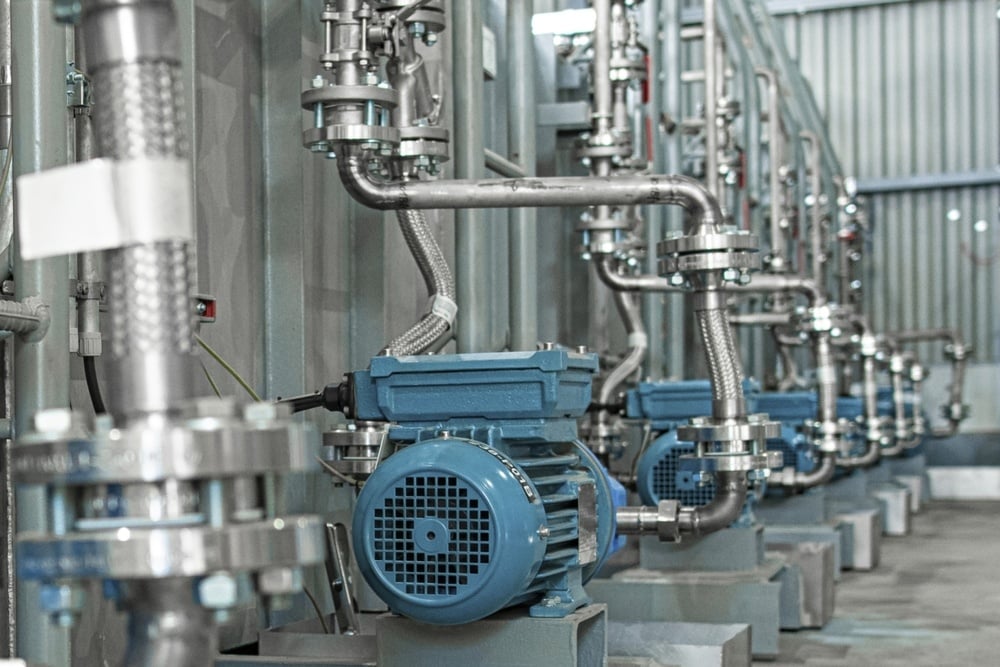 stainless steel tanks and pumps in manufacturing facility